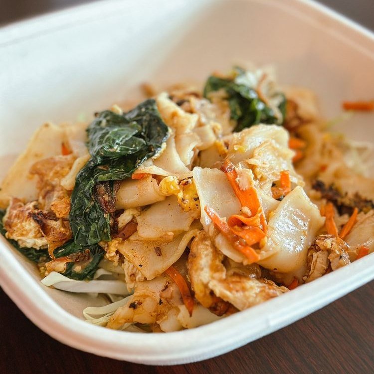 Pad see ew — wide rice noodles with greens and carrot